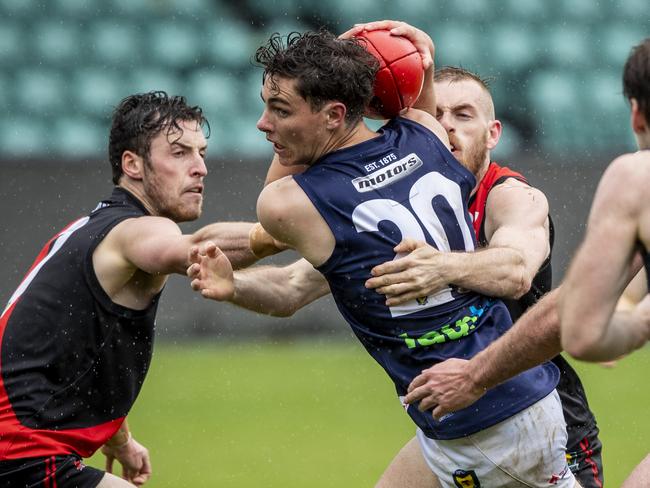 Launceston’s Jared Dakin is tackled by North Launceston’s Josh Ponting. Picture: LUKE BOWDEN