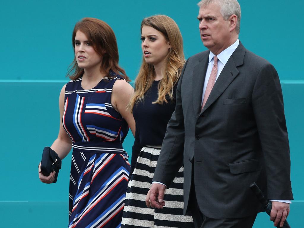 Prince Andrew with his daughters, Princess Eugenie and Princess Beatrice. Picture: AFP