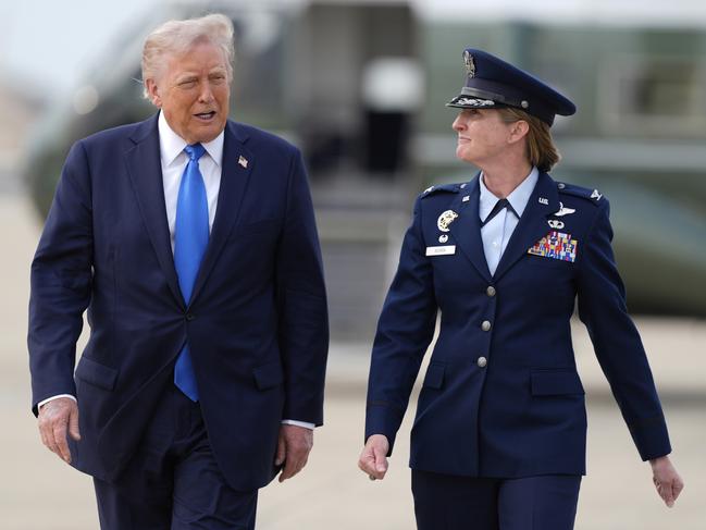President Donald Trump walks with air force Colonel Angela Ochoa, Commander of the 89th Airlift Wing from Marine One. Picture: Manuel Balce Ceneta / AP