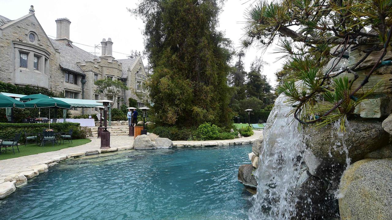 The swimming pool at the Playboy Mansion where Hollywood's elite cavorted with scantily-clad ‘bunnies’. Picture: Frederic Brown/AFP