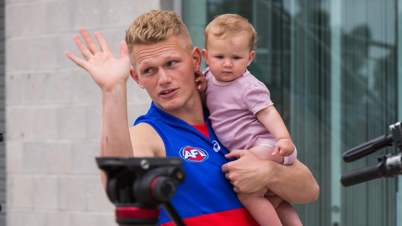 Adam Treloar with his daughter Georgie at Whitten Oval. The terms of his split with Collingwood have finally been sorted. Picture: NCA NewsWire / Paul Jeffers