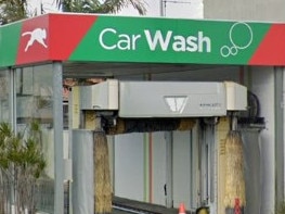 WorkSafe has charged the operator of this car wash, where a 73 year old died after becoming crushed