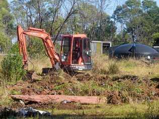 CRIME SCENE: Police used excavators to dig up a large section of a property at Lanitza in the search for missing person Patrick Kear. Picture: Adam Hourigan