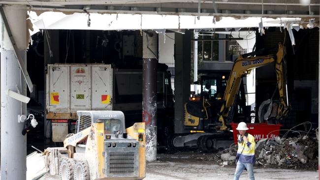 March 2023: Workers on site during the demolition of Eagle Street Pier. Picture: Steve Pohlner