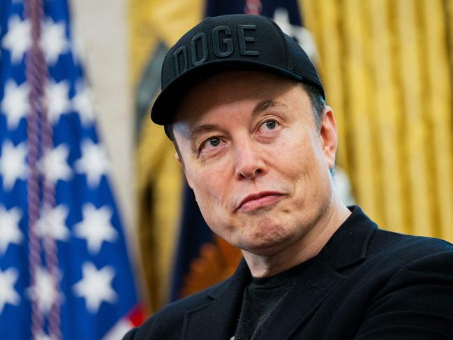 Elon Musk looks on during a news conference with US President Donald Trump in the Oval Office of the White House in Washington, DC, on May 30, 2025. Musk, who stormed into US politics as President Trump's chainsaw-brandishing sidekick, announced on May 28 that he is leaving his role in US government, intended to reduce federal spending, shortly after his first major break with the President over Trump's signature spending bill. (Photo by Allison ROBBERT / AFP)