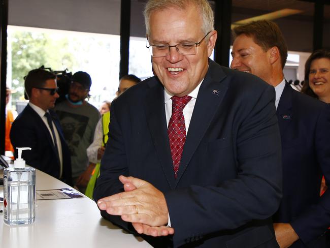 Prime Minister Scott Morrison sanitises his hands in Brisbane before saying making decisions on health measures like wearing a mask should be someone’s own choice. Picture: NCA NewsWire/Tertius Pickard