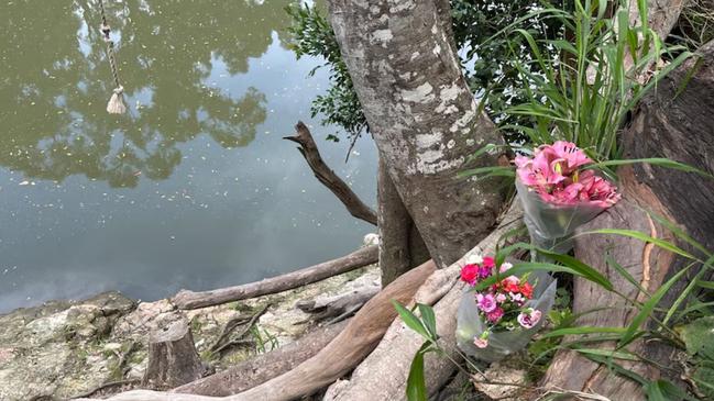 Tributes left for Manaia Tither-Asiata, who died after falling down the embankment of a Queensland river. Manaia Tither-Asiata, 18, was using a rope swing off a steep rock wall when he fell about 15m into the Coomera River at Maudsland about 6.40pm on Sunday. Picture: ABC