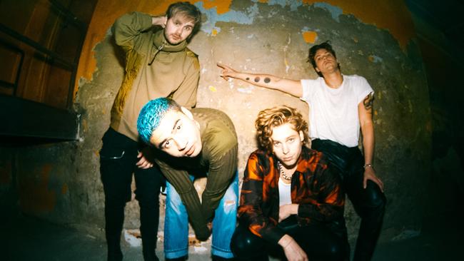 Blue hair, don’t care! 5SOS are also dictating how they are marketed for CALM. Picture: Supplied.