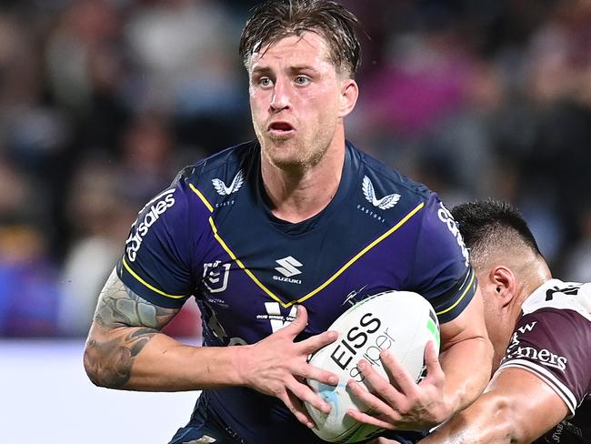 SUNSHINE COAST, AUSTRALIA - SEPTEMBER 10: Cameron Munster of the Storm is tackled during the NRL Qualifying Final between the Melbourne Storm and the Manly Warringah Sea Eagles at Sunshine Coast Stadium on September 10, 2021, in Sunshine Coast, Australia. (Photo by Bradley Kanaris/Getty Images)