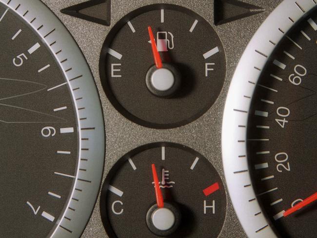 Fuel (top) and temperature gauge on dashboard of motor car 07 Nov 2002. petrol/Automobiles