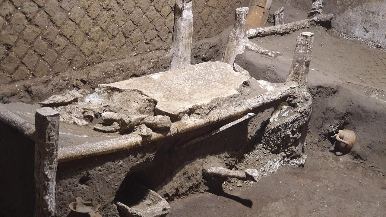 An exceptionally well-preserved room for slaves who worked in Villa Civita Giuliana just outside the ancient city of Pompeii has been unearthed. It is the same villa where a ceremonial chariot and a stable with a harnessed horses were discovered earlier this year. Picture: AFP Photo/Pompeii Archaeological Park