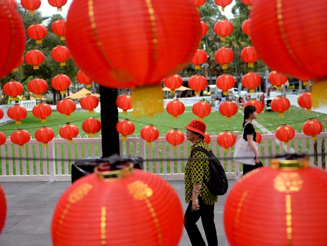 SYDNEY, AUSTRALIA - NewsWire Photos FEBRUARY 12, 2021.Visitors to Darling Harbour in Sydney enjoy the decorations as Chinese New Year celebrations begin in the Year of the OX. Picture: NCA NewsWire / Jeremy Piper
