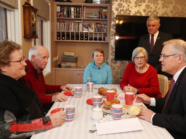 PM Scott Morrison talking to Wendy and Ray White who are recipients of in-home care, with  Lynne McKeough while visiting Louise Josephs home in Canberra, with Minister for Indigenous Health, Senior Australians and Aged Care Ken Wyatt , Assistant Minister for Treasury and Finance Senator Zed Seselja. Picture Kym Smith