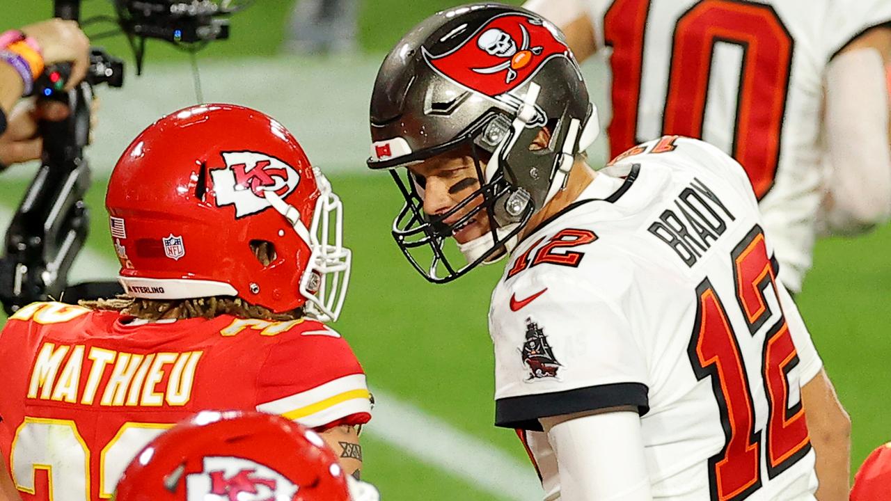 Tom Brady of the Tampa Bay Buccaneers speaks to Tyrann Mathieu of the Kansas City Chiefs during the second quarter in Super Bowl LV.