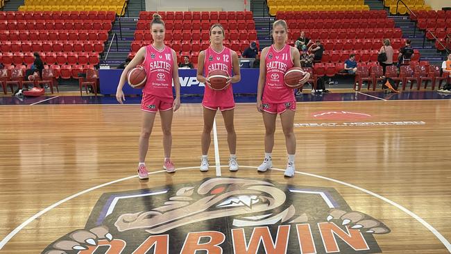 Darwin Salties players Jessica Boundy, Erin Bollmann and Ruby Porter at the Croc Pot wearing their pink jerseys ahead of Saturday's match honouring Territory mum's ahead of Mother's Day.