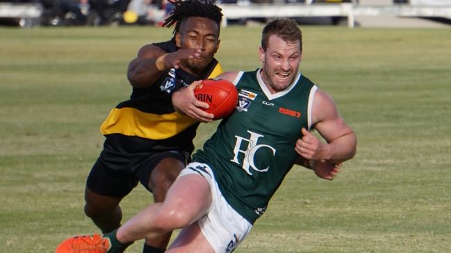 Imperials midfielder Bryce Hards attempts to escape a tackle against Red Cliffs at Mildura's Brian Weightman Oval in round three. Picture: Michael DiFabrizio