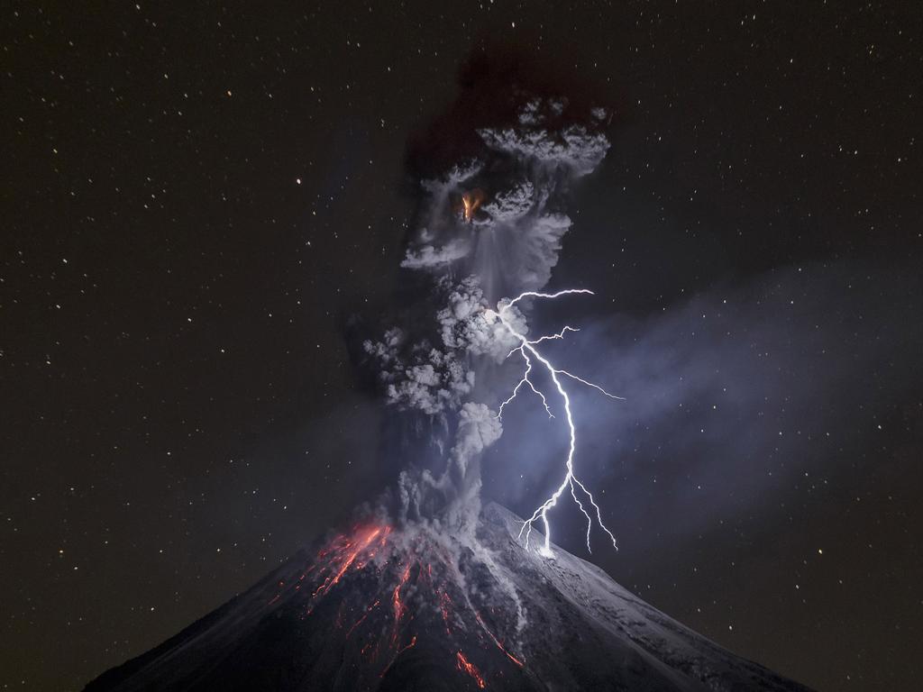 “The Power of Nature” by photographer Sergio Tapiro which won the third prize in the Nature Singles category shows a powerful night explosion of the Colima Volcano with lightning, ballistic projectiles and incandescent rockfalls, Comala municipality in Colima, Mexico, 13 December 2015. (Sergio Tapiro, World Press Photo via AP)