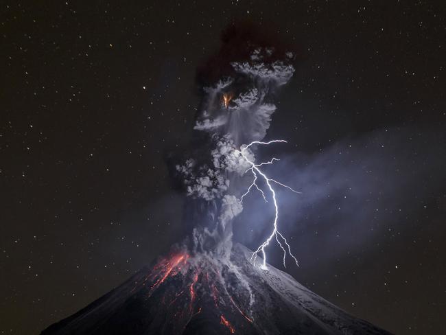 “The Power of Nature” by photographer Sergio Tapiro which won the third prize in the Nature Singles category shows a powerful night explosion of the Colima Volcano with lightning, ballistic projectiles and incandescent rockfalls, Comala municipality in Colima, Mexico, 13 December 2015. (Sergio Tapiro, World Press Photo via AP)