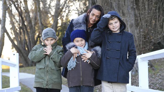 Natalie Ryan, with her twin boys Angus and Oliver (green jacket) Ryan, 8, and older brother Bede Ryan, 10, rug up in Oberon — statistically the coldest town in NSW. Picture: Dylan Robinson