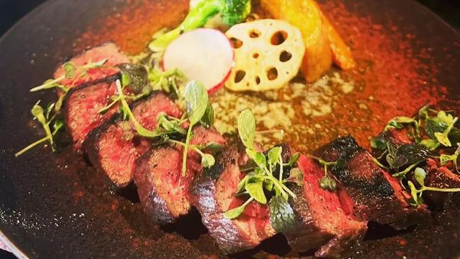 Sliced, freshly grilled Wagyu steak at Raku Izakaya. Picture: Instagram / Supplied