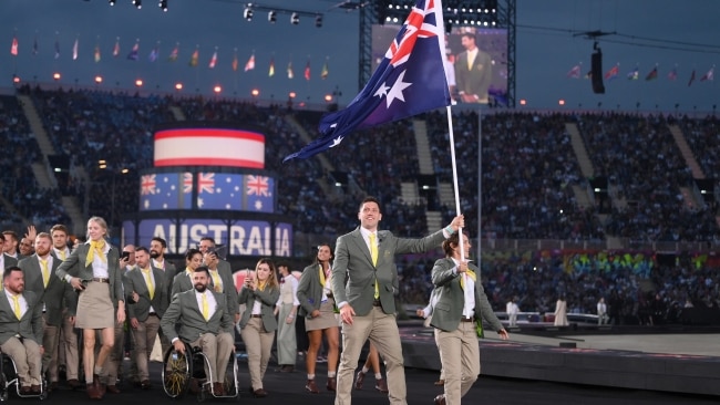 Australian flag bearers Eddie Ockenden and Rachael Grinham lead the team out during the Opening Ceremony of the Birmingham 2022 Commonwealth Games. Picture: David Ramos/Getty Images