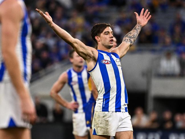 PERTH, AUSTRALIA - JUNE 08: Jy Simpkin of the Kangaroos celebrates a goal during the 2024 AFL Round 12 match between the West Coast Eagles and the North Melbourne Kangaroos at Optus Stadium on June 08, 2024 in Perth, Australia. (Photo by Daniel Carson/AFL Photos via Getty Images)