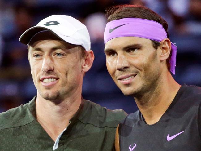 Rafael Nadal of Spain poses with John Millman of Australia before their Round 1 men's Singles match at the 2019 US Open at the USTA Billie Jean King National Tennis Center in New York on August 27, 2019. (Photo by Kena Betancur / AFP)