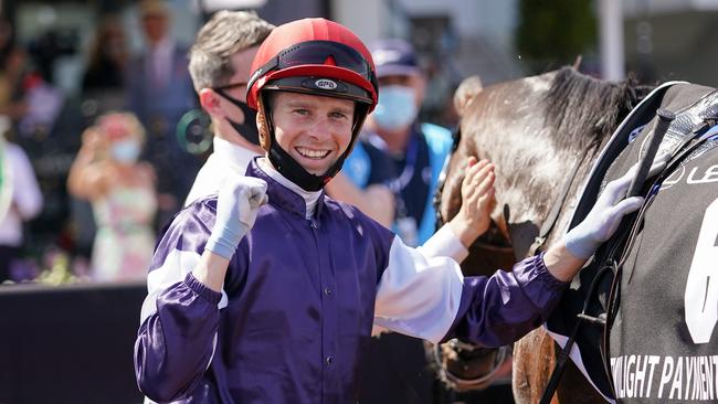 Jye McNeil returns to the mounting yard with Twilight Payment after winning the Lexus Melbourne Cup at Flemington Racecourse. Picture: Scott Barbour