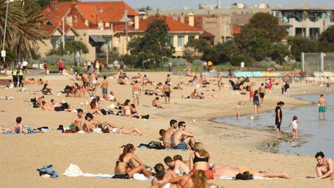 St Kilda beach was packed with sun-seekers on Friday afternoon before police arrived