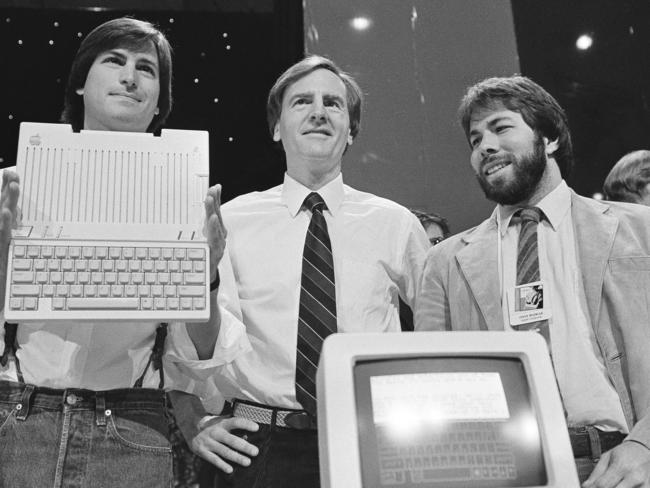 Steve Jobs, left, chairman of Apple Computers, John Sculley, centre, president and CEO, and Steve Wozniak, co-founder of Apple, in April 1984. Picture: AP