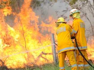 A generic image of fire fighters fighting a vegetation fire. A grass fire along North Deep Creek Rd is throwing up a lot of smoke, prompting warnings for drivers in the area. Picture: Brenda Strong