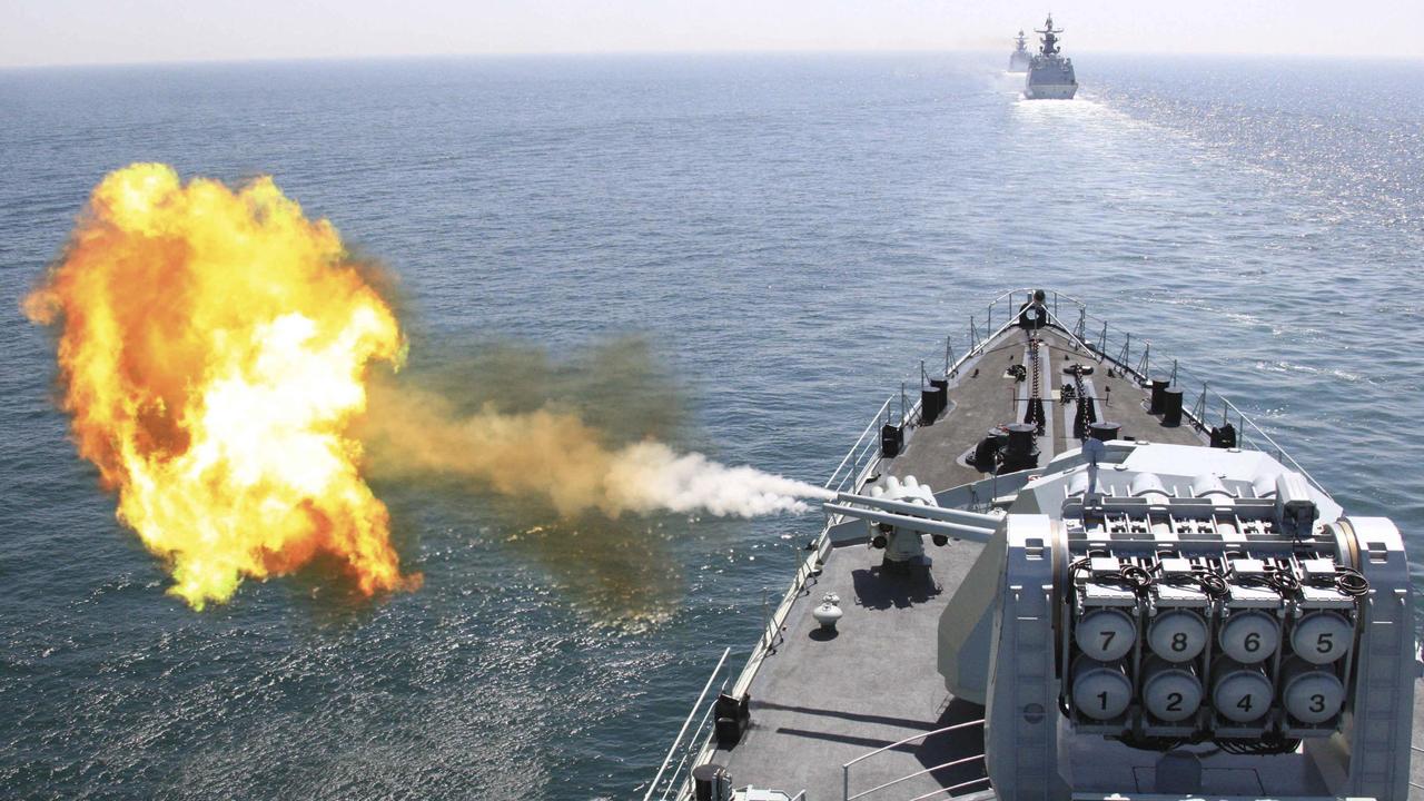 In this photo released by China's Xinhua News Agency, Chinese navy's missile destroyer DDG-112 Harbin fires a shell during the China-Russia joint naval exercise in the Yellow Sea Thursday, April 26, 2012. Chinese and Russian warships concluded a live ammunition exercise on Thursday, following a no-weapon joint war game earlier the same day, Xinhua said. (AP Photo/Xinhua, Wu Dengfeng) NO SALES