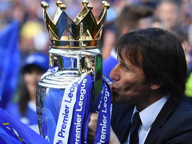 Chelsea's Italian head coach Antonio Conte kisses the English Premier League trophy