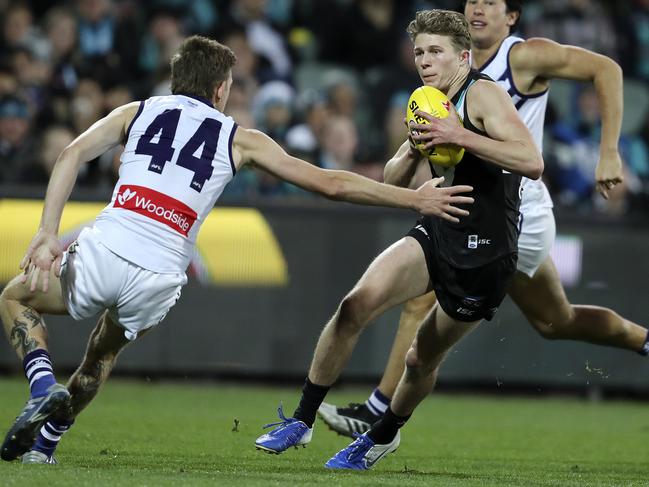 AFL - Port Adelaide v Fremantle at Adelaide Oval. Xavier Duursma dodges Taylin Duman Picture SARAH REED