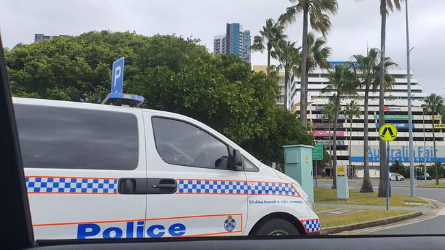 Police stopping traffic on Marine Parade.