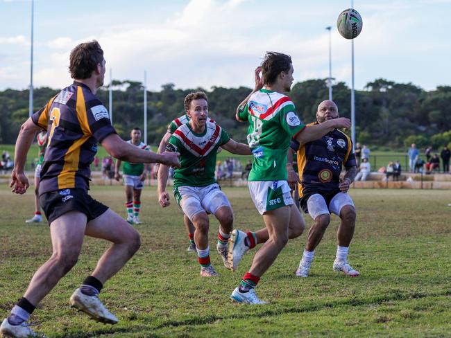 Rylan Barnes watches the ball go over the dead ball line while Rick Lyons watches on. Picture: Adam Wrightson Photography