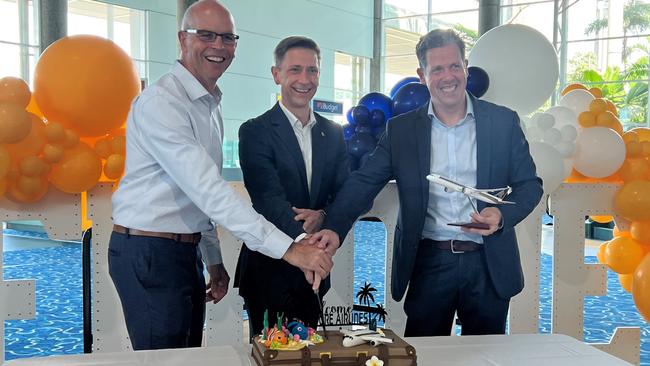 Richard Barker (Cairns Airport), Karl Schubert (Singapore Airlines) and Mark Olsen (Tourism Tropical North Queensland) cut a cake celebrating the return of international travel and visitors to Cairns. Picture: Yashee Sharma