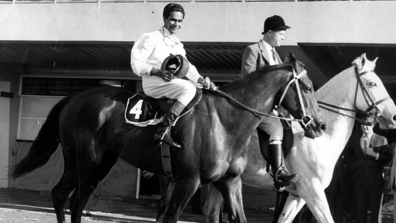 Darby McCarthy returns after winning the 1963 Stradbroke Handicap on Mullala. Picture: The Courier-Mail Photo Archive