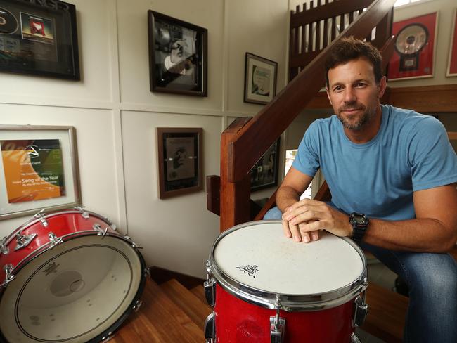 28/2/2018: Jon Coghill, former drummer of Powderfinger, who has suffered hearing loss during his career as a professional musician and now wears hearing aids as a result, at his home at Marcus Beach, Sunshine Coast QLD. The band finished up in 2010, and he has worn hearing aids since around that time. Lyndon Mechielsen/The Australian