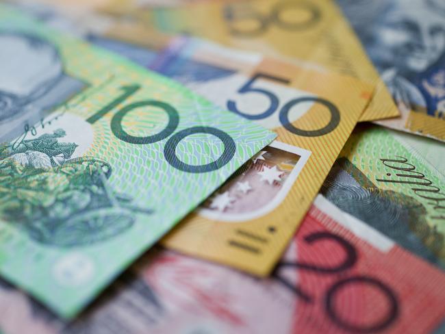 Australian money background showing $100, $50 and $20 notes with a shallow depth of field.