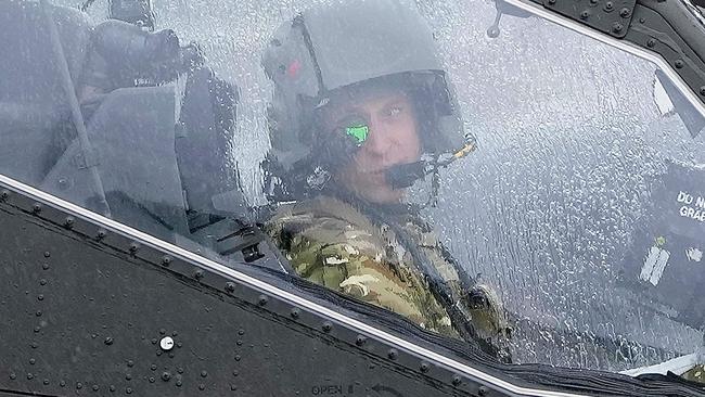 Prince William sat in the cockpit of an Apache helicopter at the Army Aviation Centre in Middle Wallop, England, on Monday, when he was officially handed the role of Colonel-in-Chief of the Army Air Corps. Picture: AFP