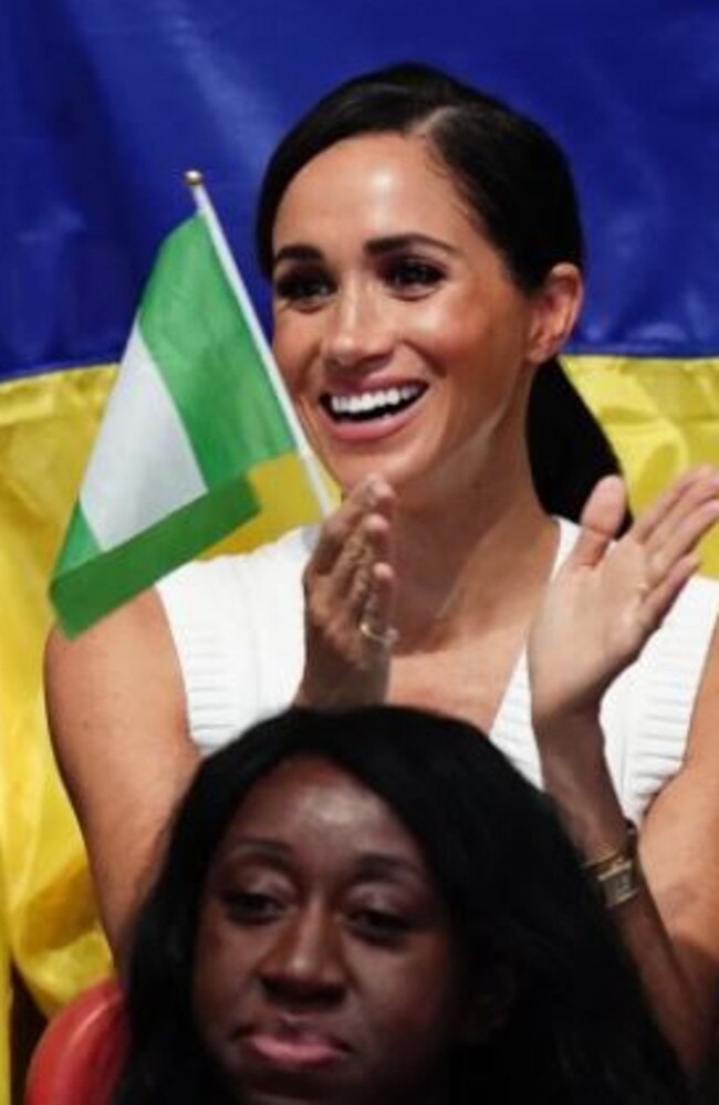 Meghan Markle waves the Nigerian flag at the Invictus Games. Picture: Supplied