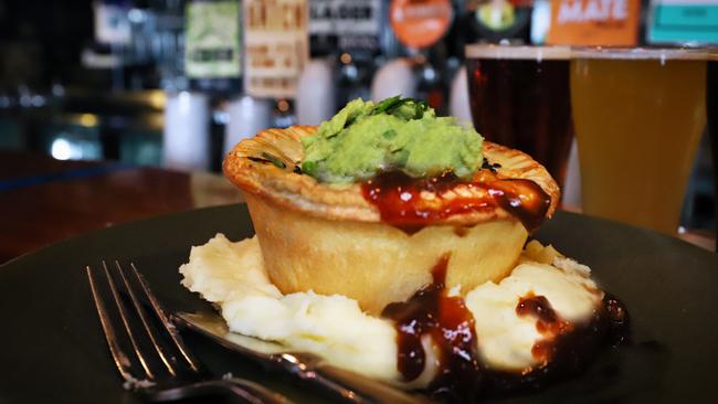 The pub’s meat pie with a beer paddle. Picture: Jenifer Jagielski