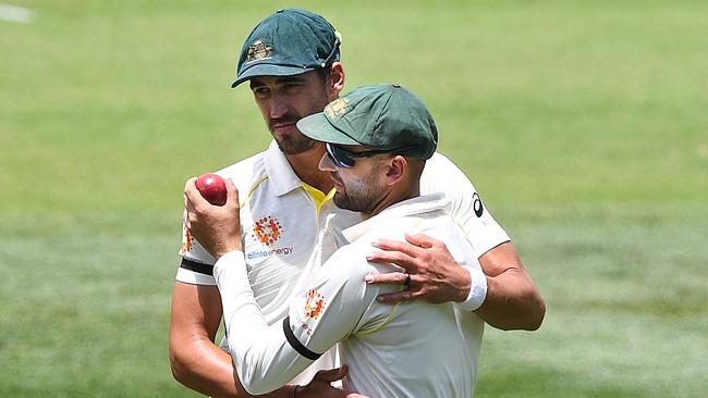 Mitchell Starc congratulates Lyon after a wicket. Picture: AAP