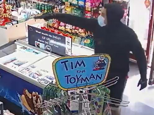 Footage shows Eric Cruz storming into a convenience store and holding a fake gun to the shopkeeper's head in front of children. Picture: Victoria Police.