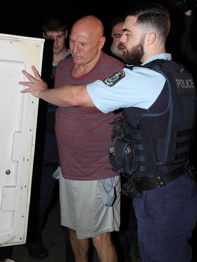 NSW Police and the AFP raided two properties in Condell Park, arresting Kevin Theobald at one home. Picture: John Grainger.