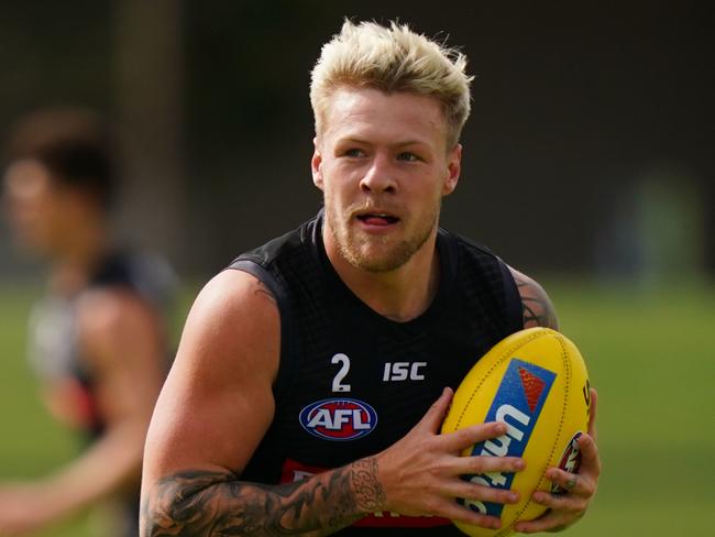 Jordan De Goey of the Magpies runs with the ball during an AFL Collingwood Football Club training session at Gosch's Paddock in Melbourne, Wednesday, March 18, 2020. (AAP Image/Scott Barbour) NO ARCHIVING