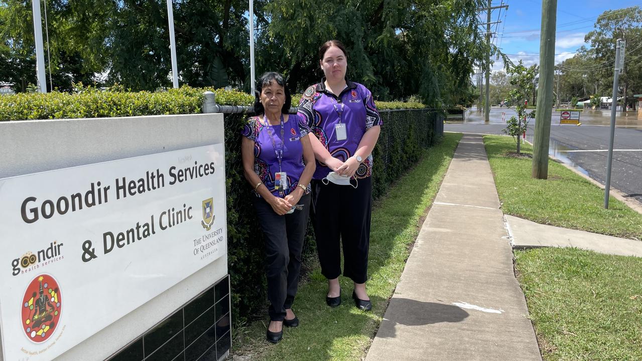 Staff from Goondir Health Services Ethel Hayden (left) and Georgia Stockwell (right) continue to work as flood water is expected to rise. Picture: Emily Devon