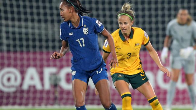 MUMBAI, INDIA - JANUARY 27: Taneekarn Dangda of Thailand controls the ball under pressure of Aivi Luik of Australia during the AFC Women's Asian Cup Group B match between Australia and Thailand at Mumbai Football Arena on January 27, 2022 in Mumbai, India. (Photo by Thananuwat Srirasant/Getty Images)