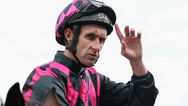 James Winks salutes after booting home a winner during his riding days.